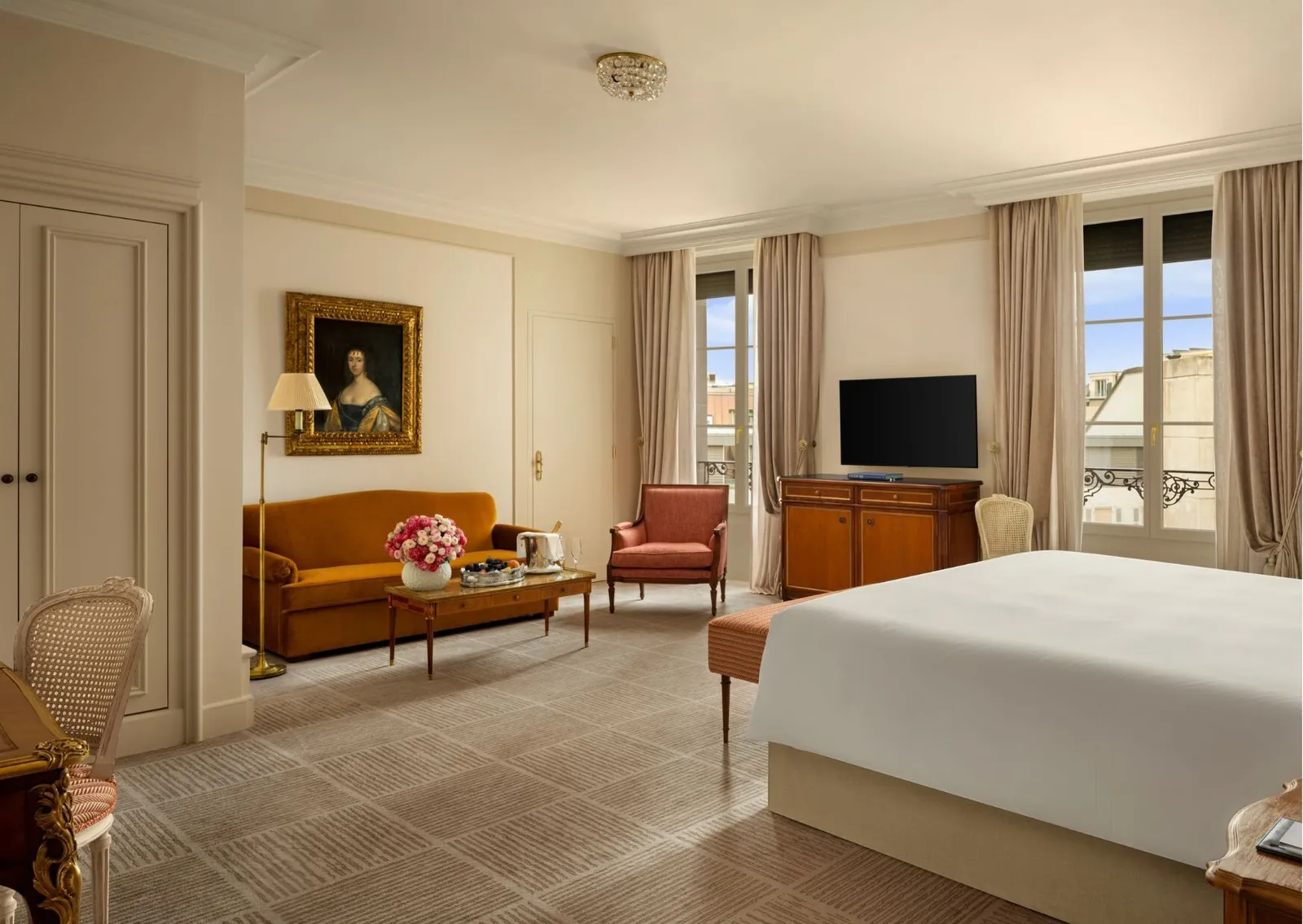 A Junior Suite Ville View sitting area, with an orange sofa
