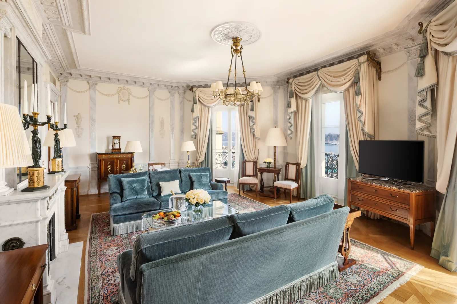 The Presidential Suite living room, with pale blue sofas