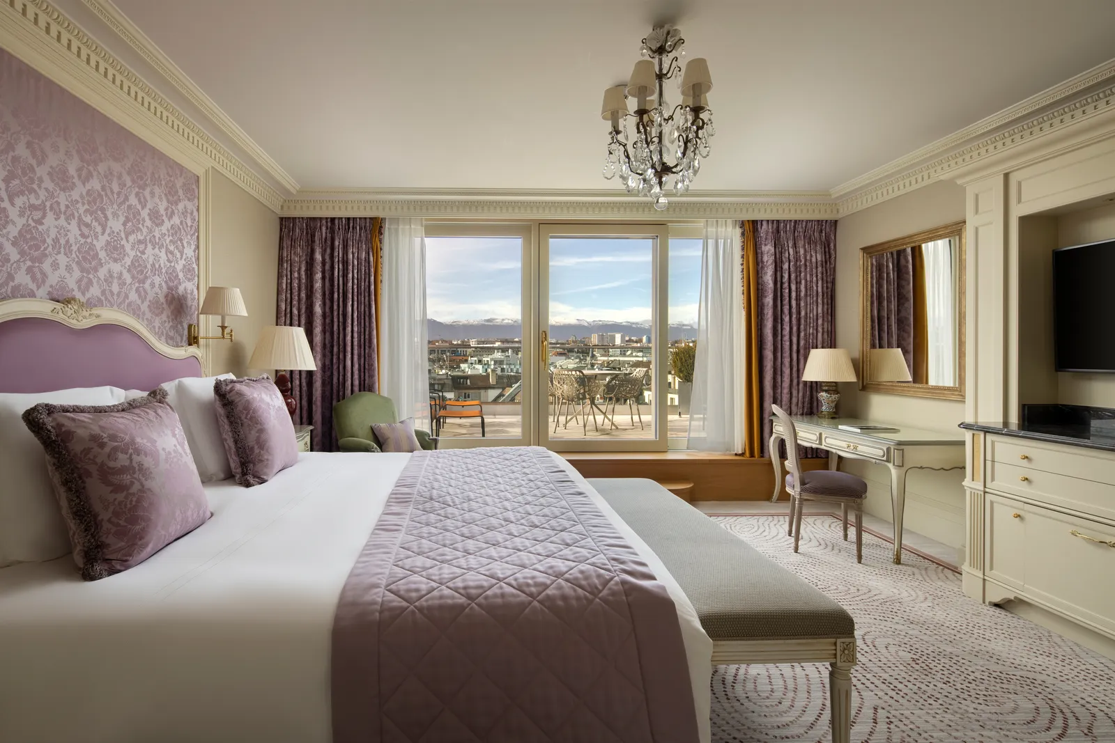 The Rooftop Junior Suite bedroom, with purple curtains