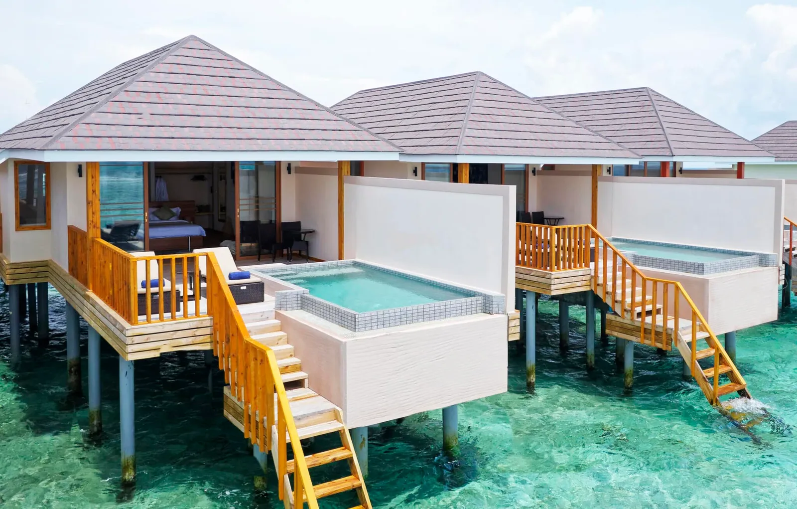 The pool on the overwater villa terrace.