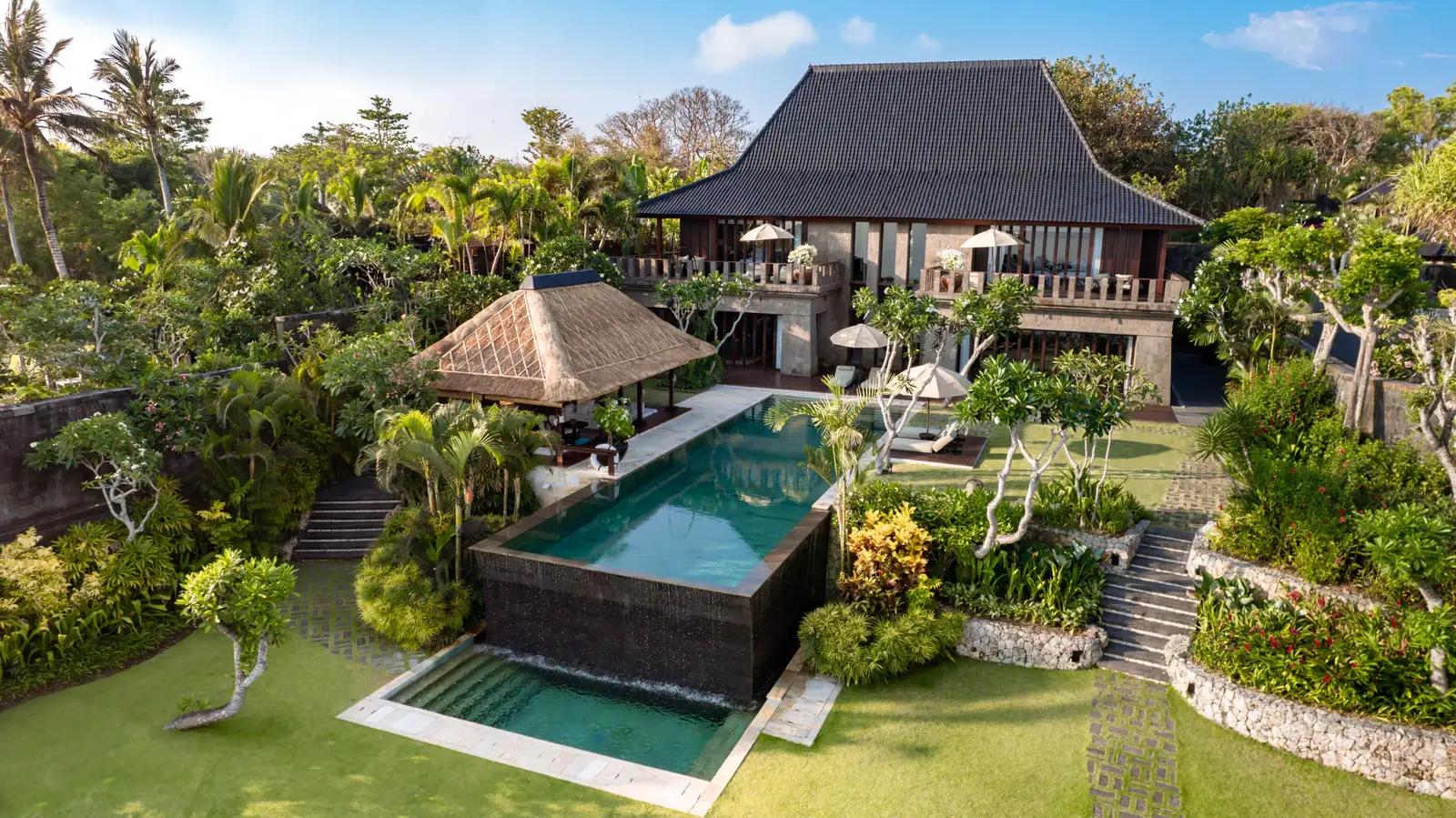 The Bvlgari Villa from the air: the house on the lawn, the pool spilling into the one below and the steps through the garden.