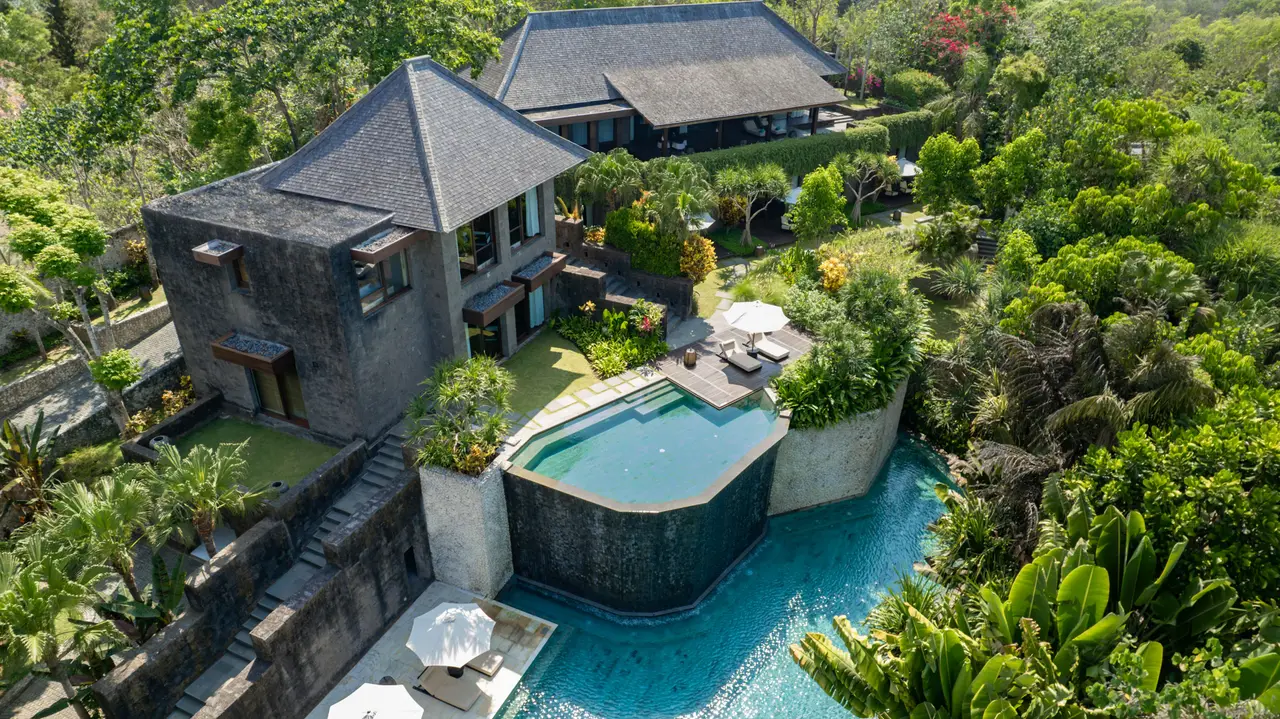 A Mansion from the air: the stone pavilion, the 2-tier pool and the tropical garden on the hillside.