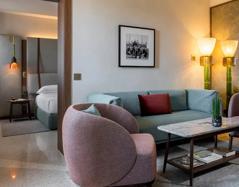 The living room of an Executive Suite, with the bedroom beyond the door