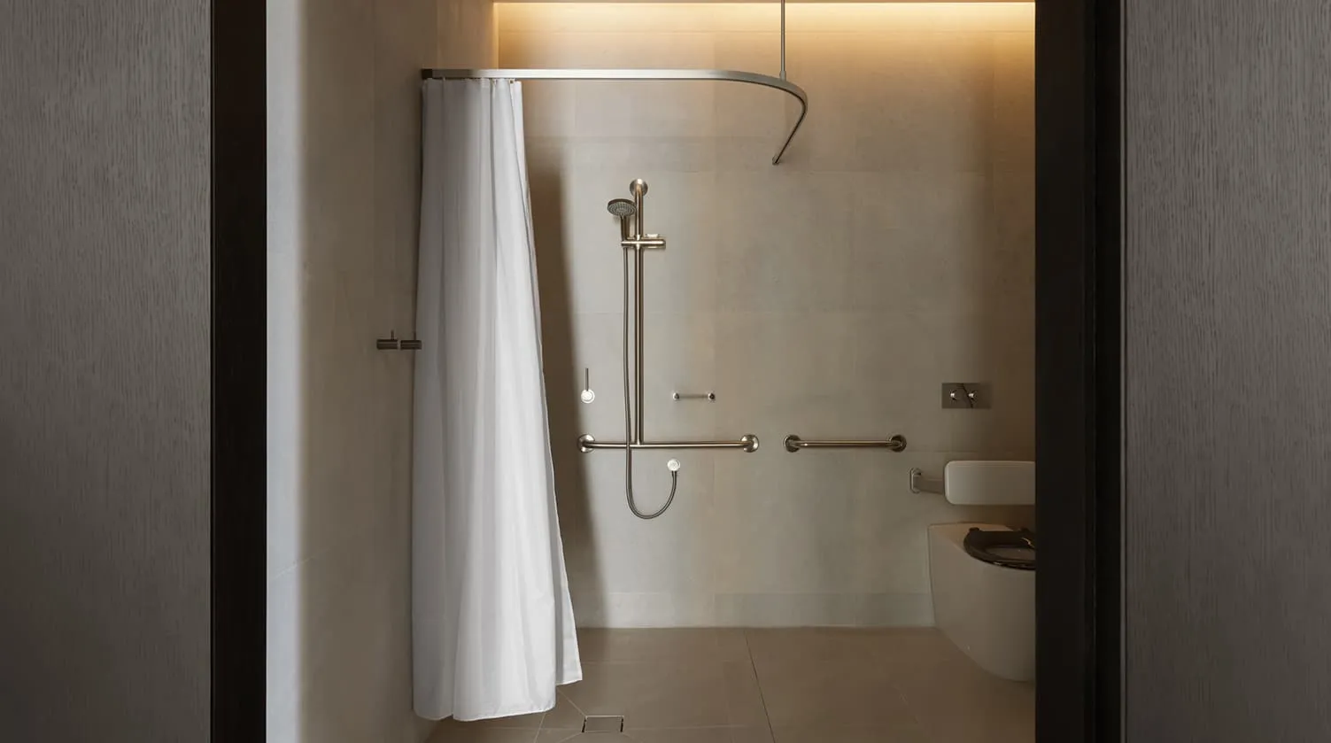 An accessible bathroom: a walk-in shower with a curtain and grab rails