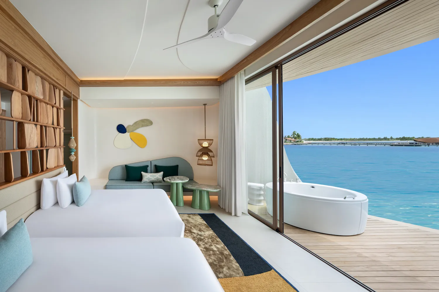 2 single beds and, on the deck over the water, the white Jacuzzi
