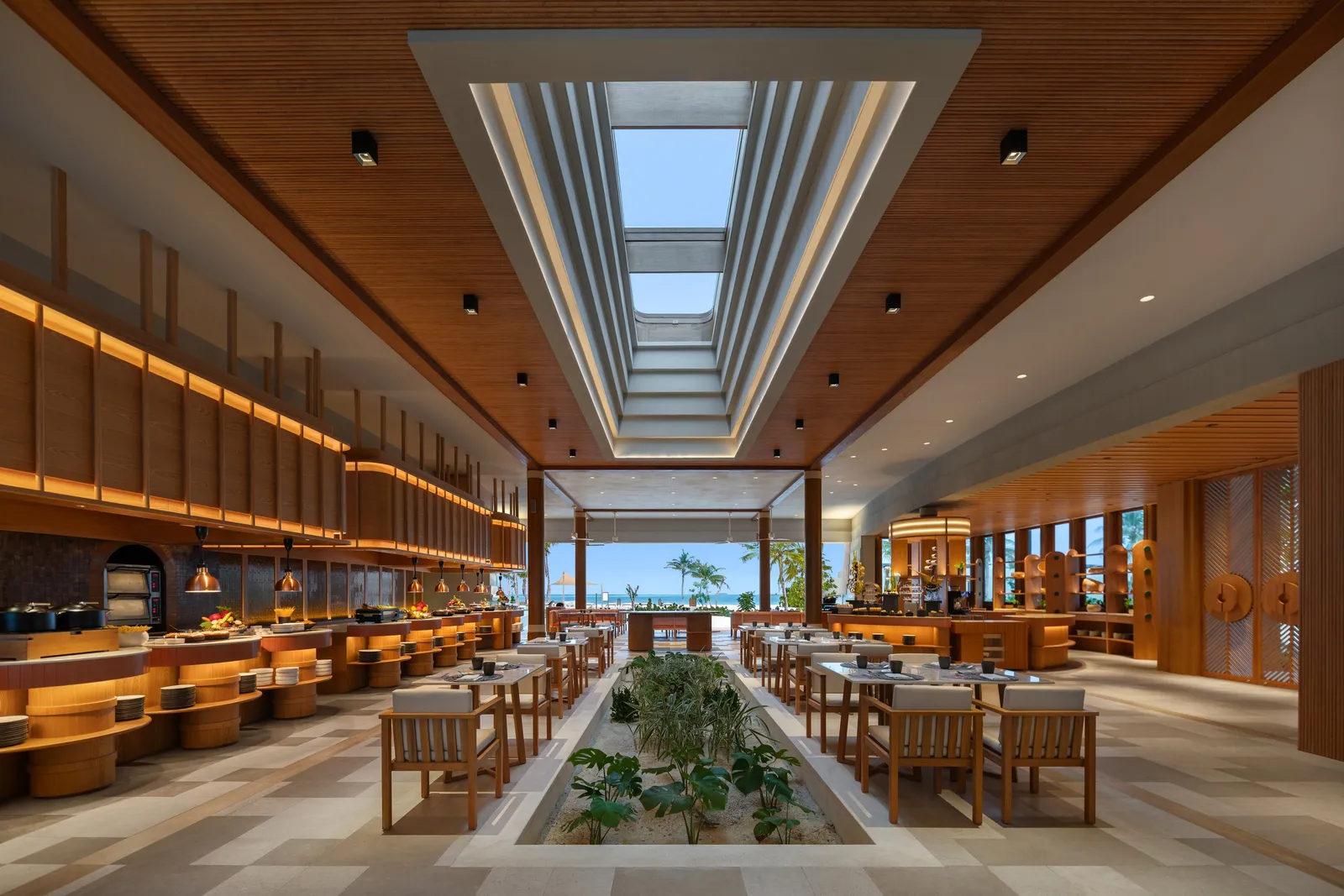 The Gallery’s dining room: a long skylight, wooden counters and tables facing the sea