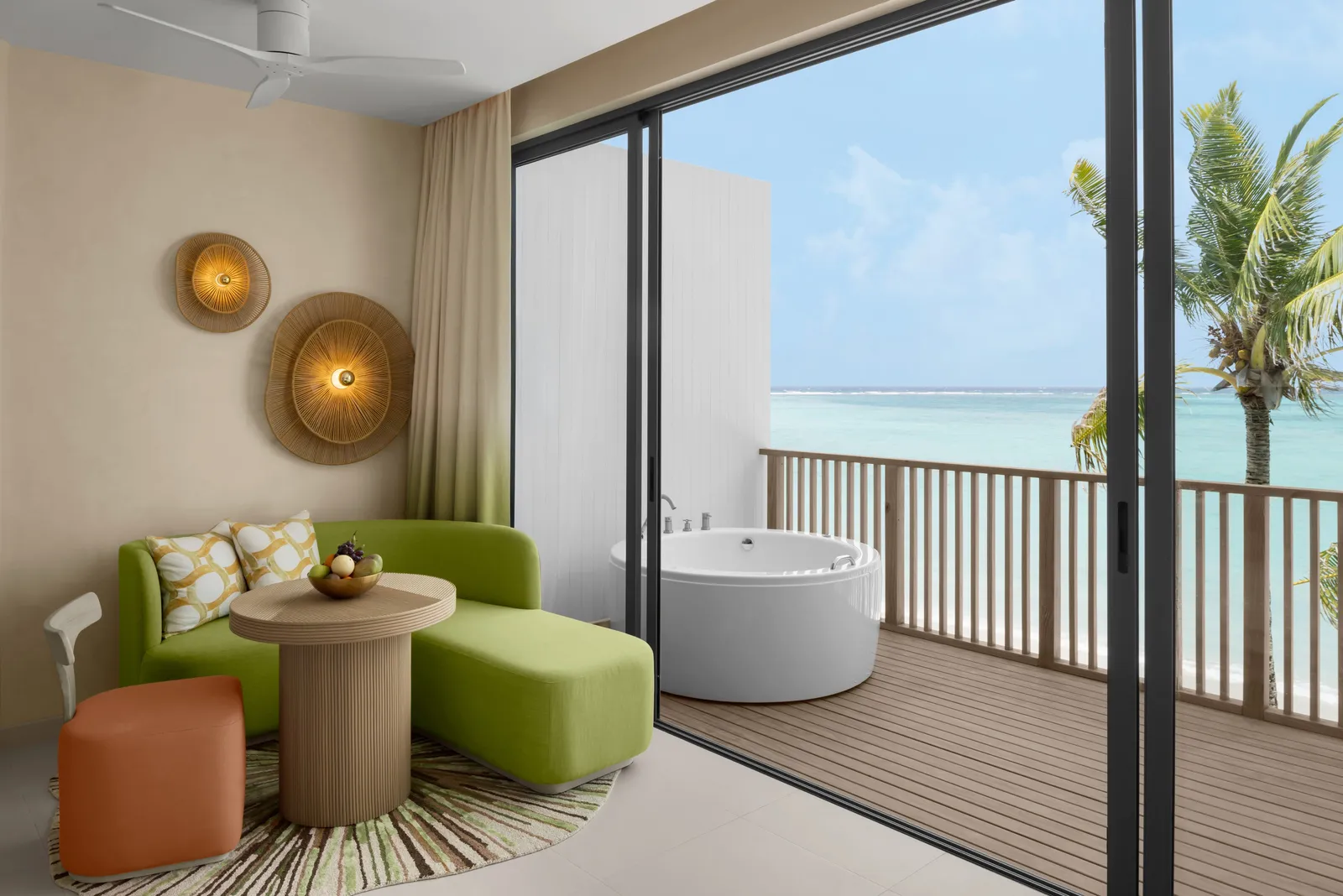 The balcony of a Mirage Panoramic Room with its Jacuzzi, the sea beyond the railing