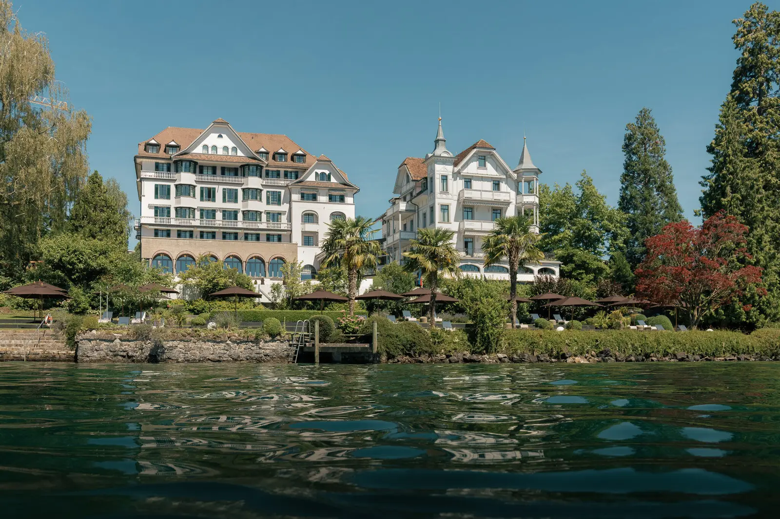 Chenot Palace and its turreted villa seen from the lake
