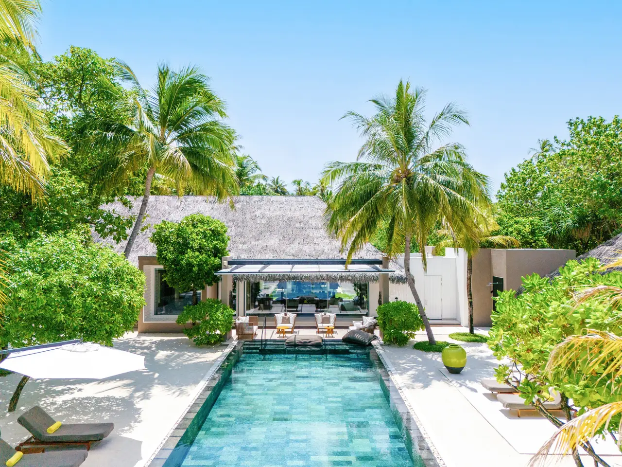 2-bedroom Island Villa: the pool and pavilion among the palms