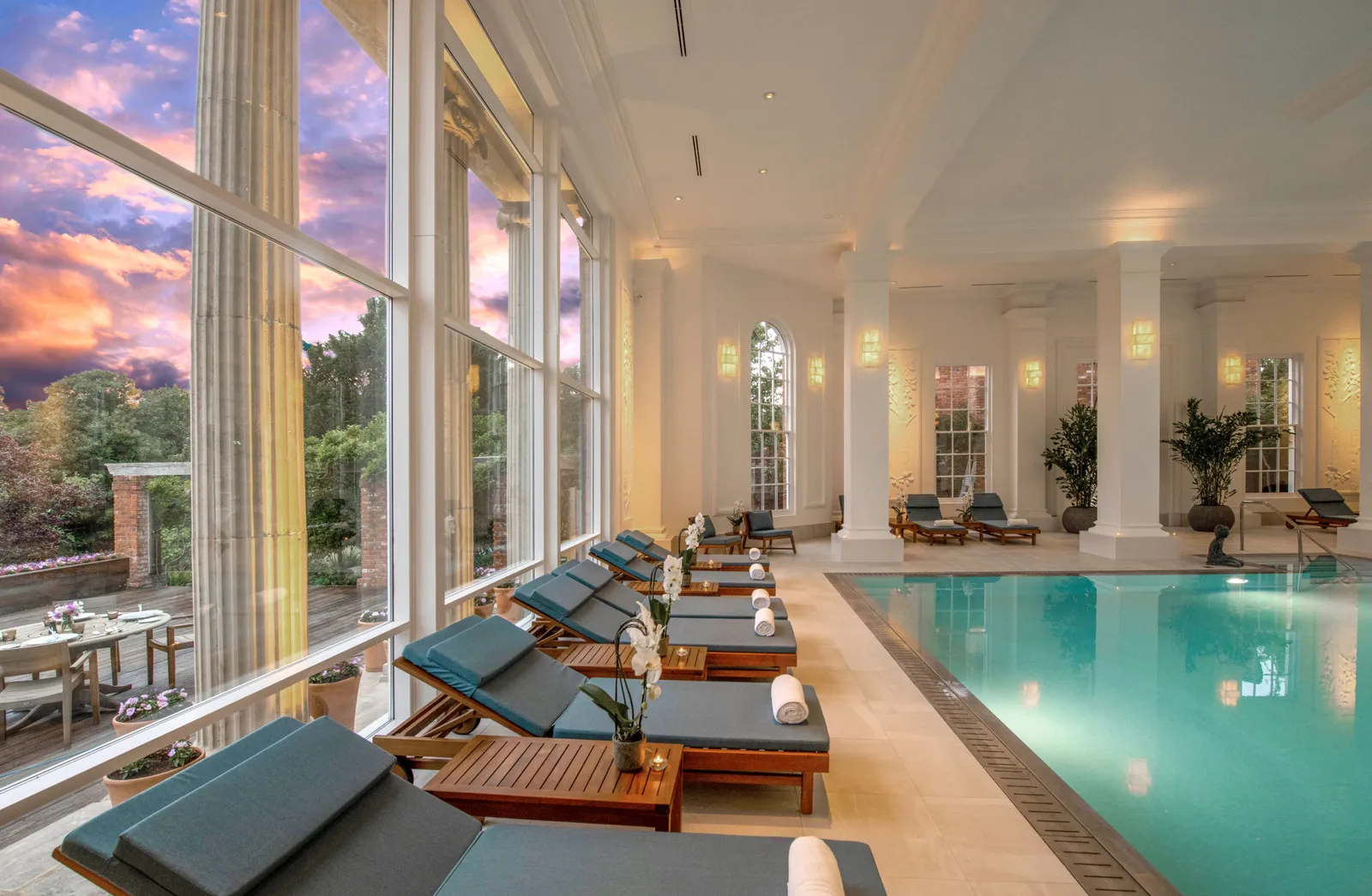 The 17-metre indoor pool between its columns, loungers along the windows
