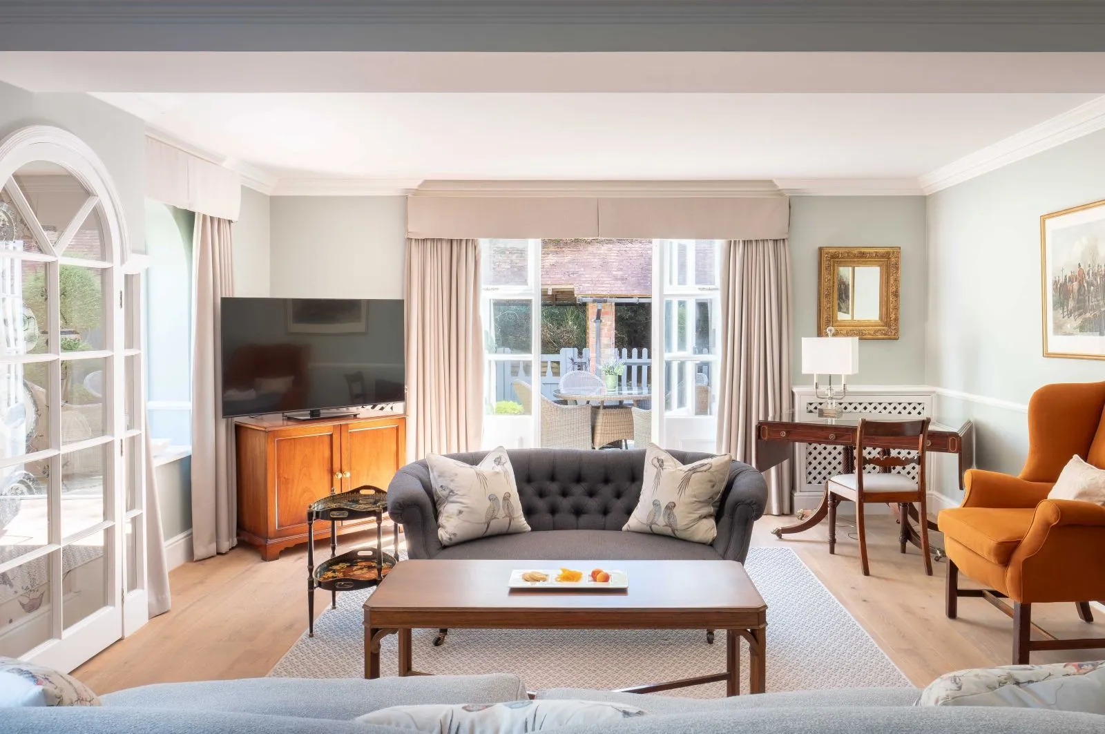 The Coach House Mezzanine’s sitting room, sofa and French doors