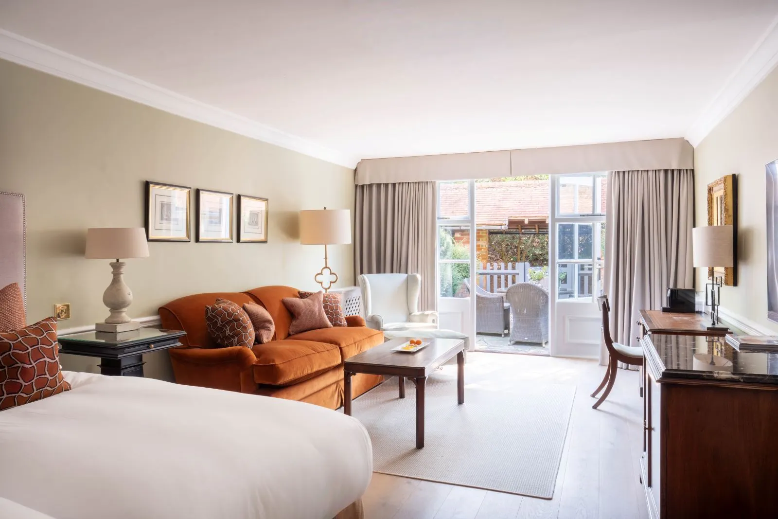 An Estate Room with its sitting area and doors onto a small terrace