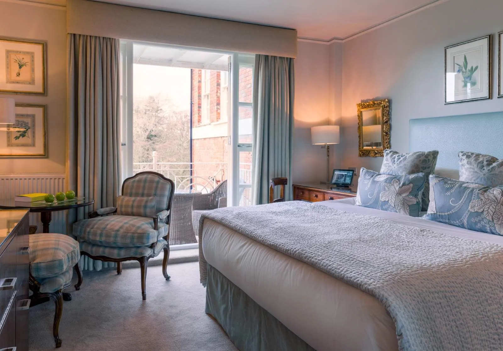 A Garden Room, the bed and the glass door onto its small balcony