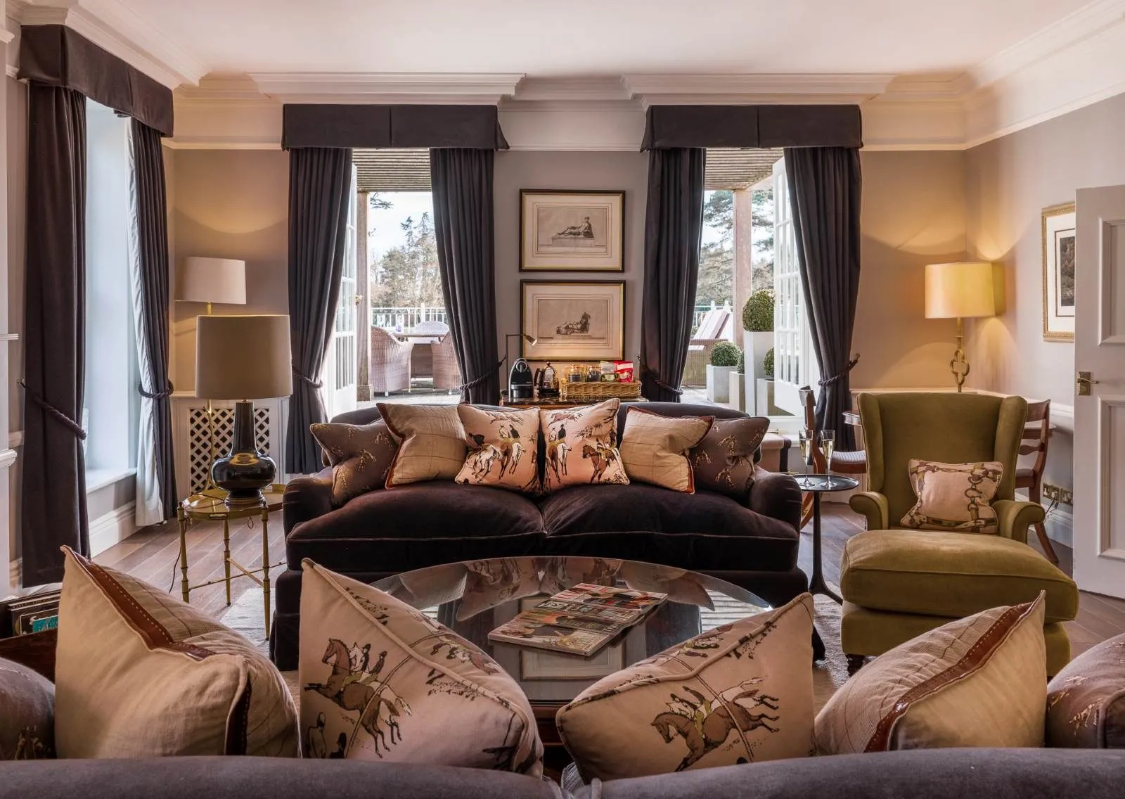The Marryat Suite’s sitting room, sofa, armchairs and the door to the terrace