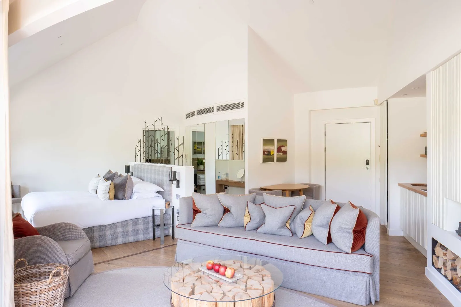 A treehouse Studio Suite, the bed and sofa under the vaulted ceiling