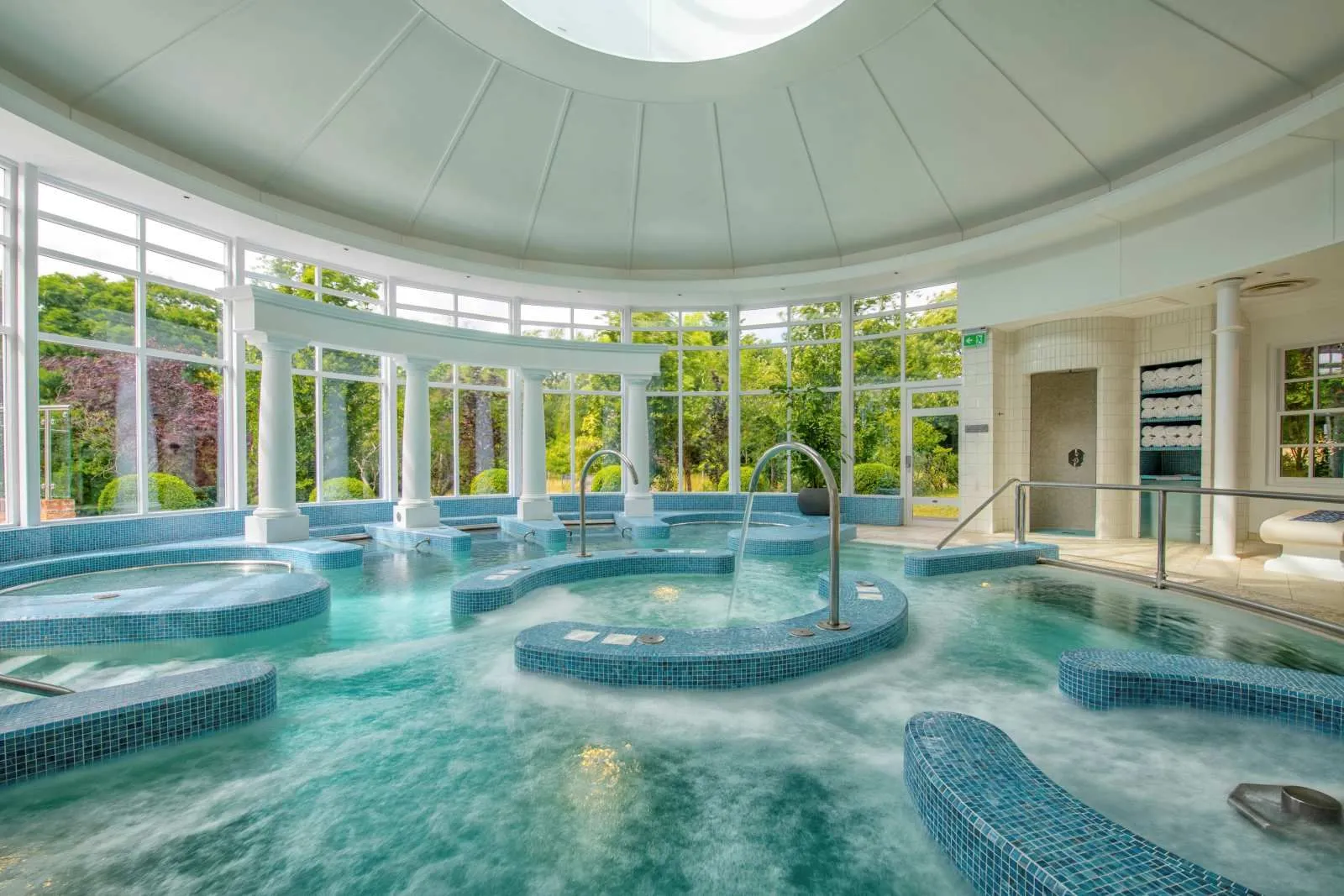 The hydrotherapy pool under its dome, with windows onto the garden
