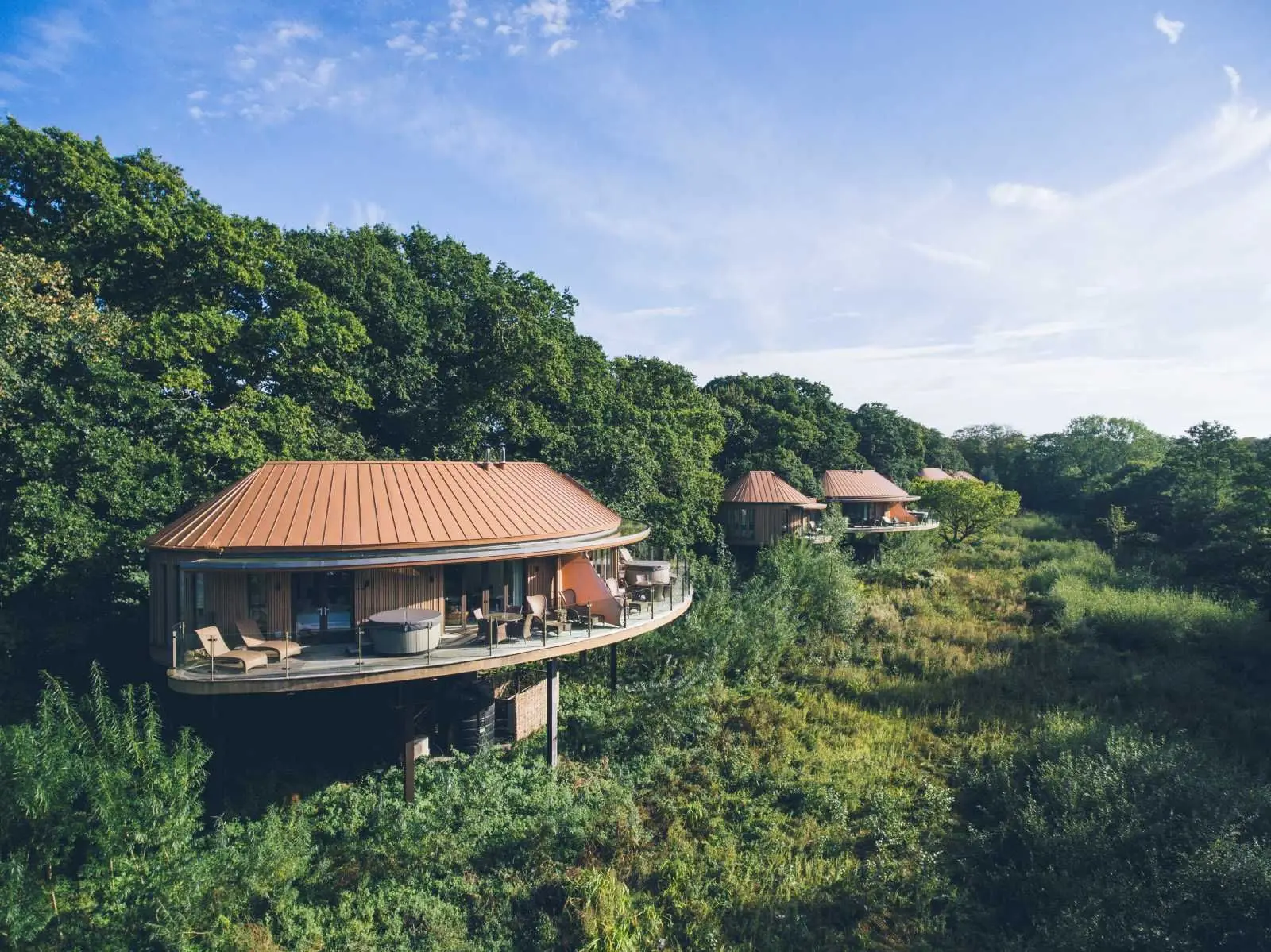 The treehouses on their stilts among the canopy of the estate’s wooded valley