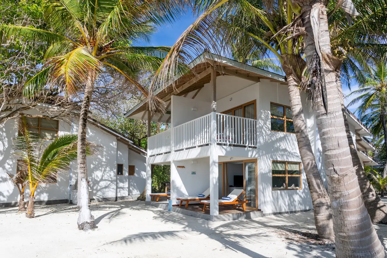 The 2-storey Duplex Garden Bungalow among the palms, with its white balcony