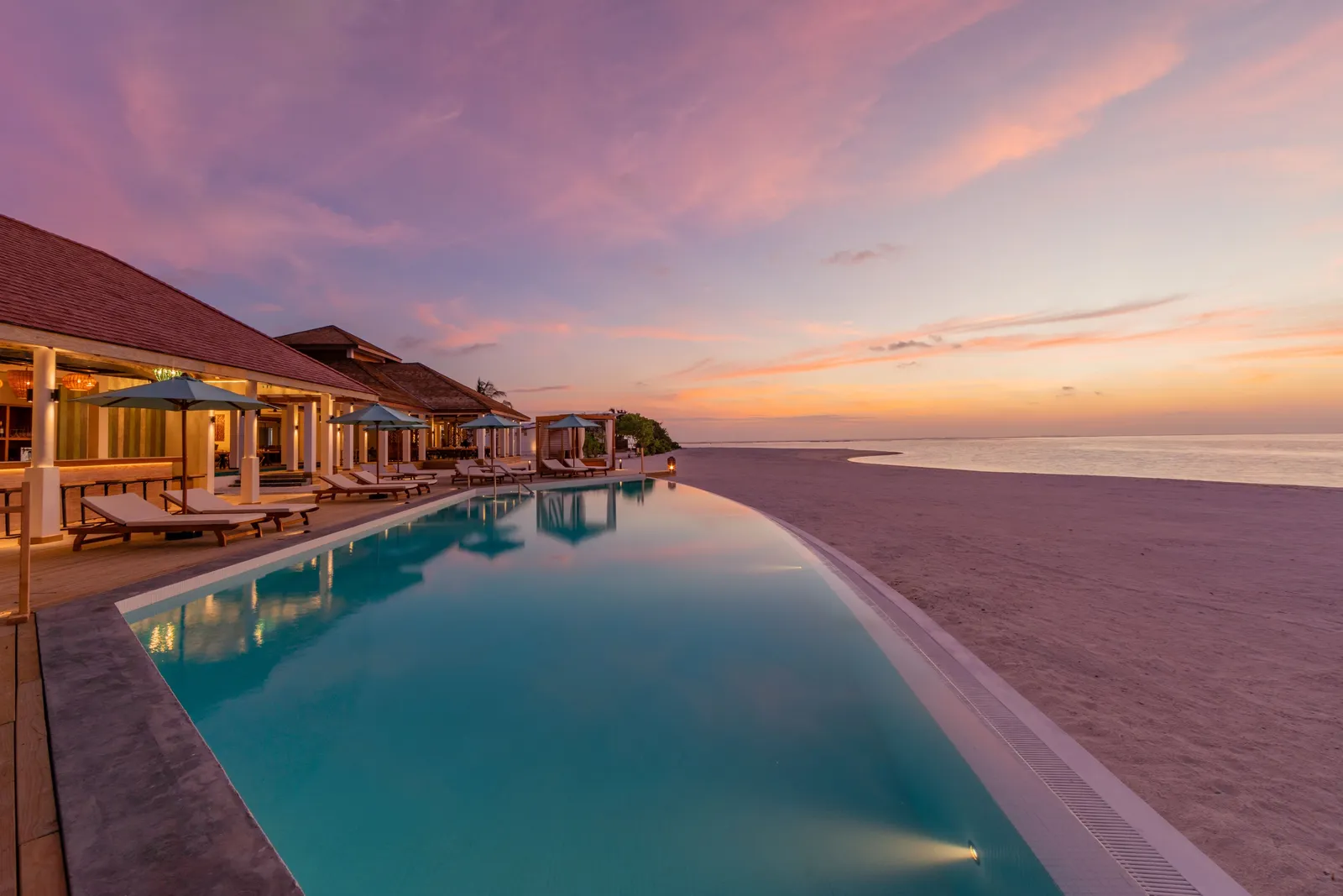 The Vevu Bar’s infinity pool at sunset, on Platinum Island