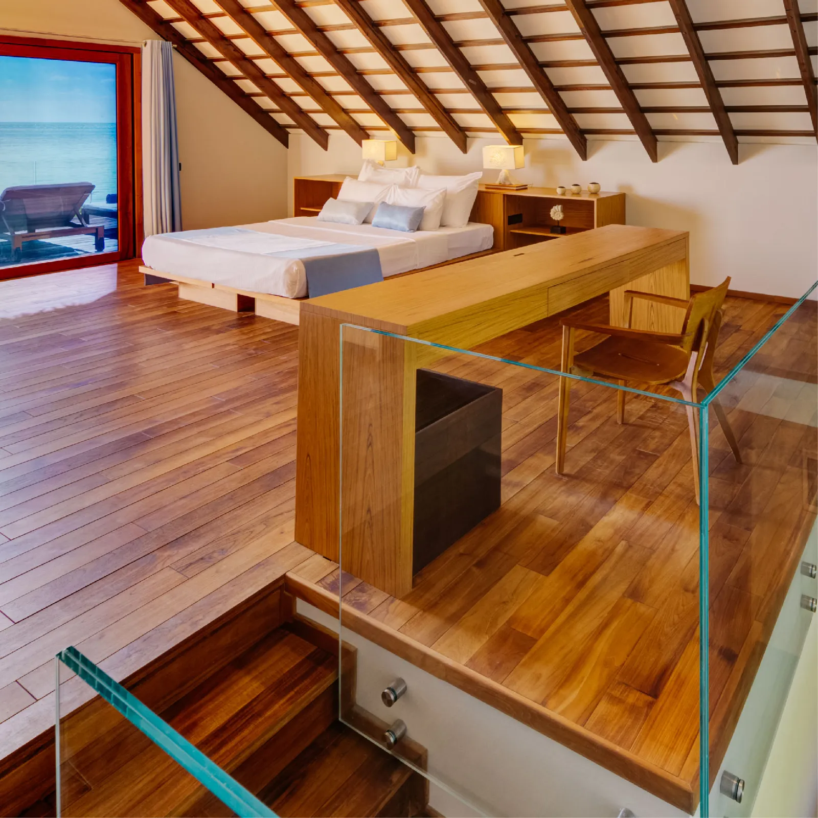 The bed and internal stairs of the 2-level Superior Beach Loft