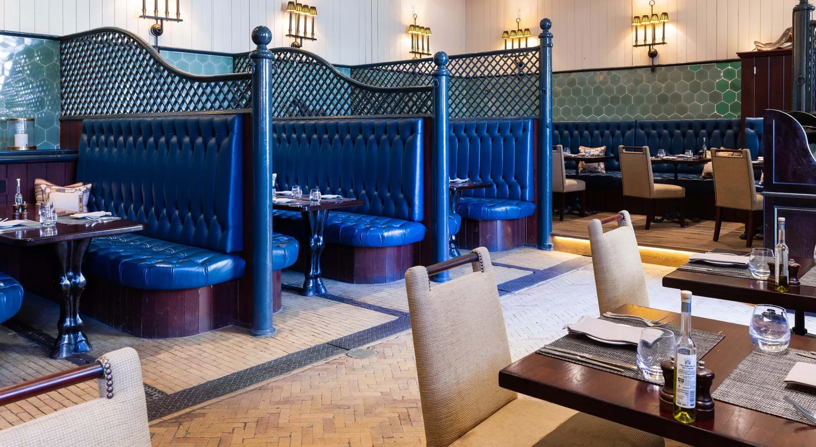 The Astor Grill: blue leather banquettes, green tiles and laid tables