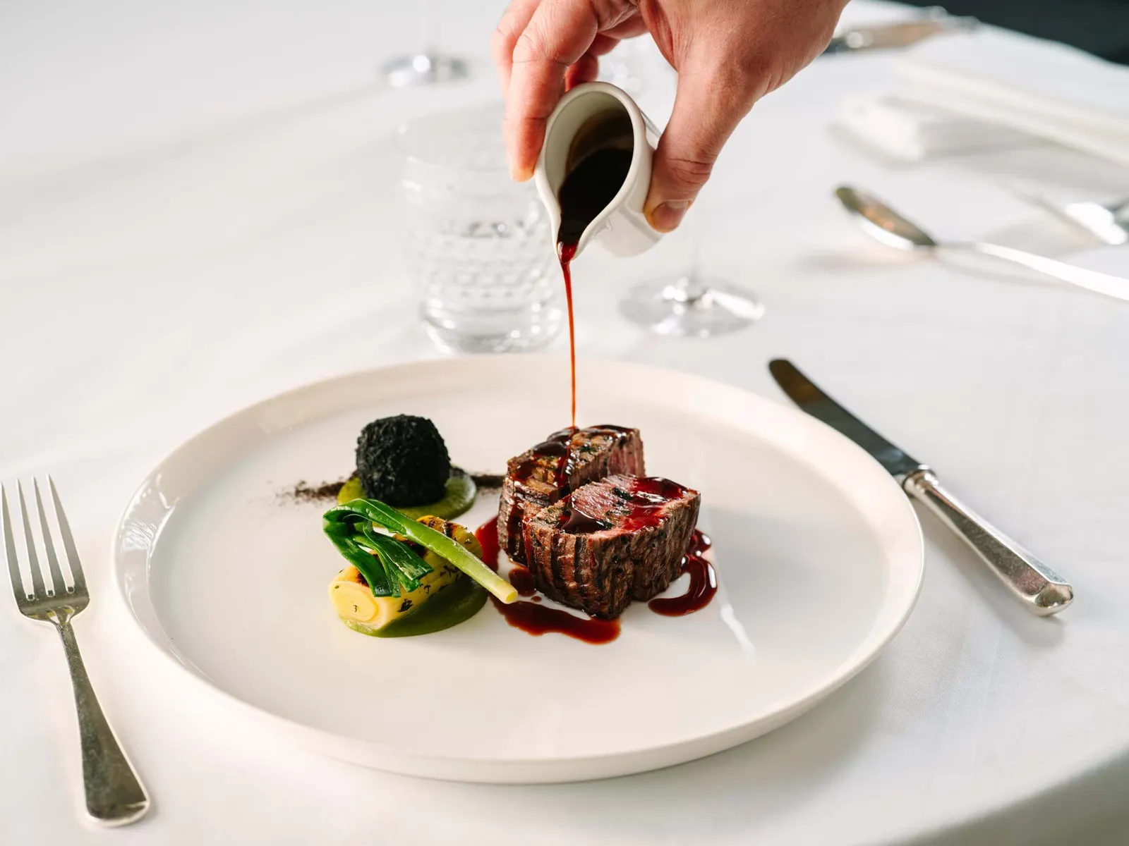 A Dining Room plate: beef fillet with sauce poured at the table