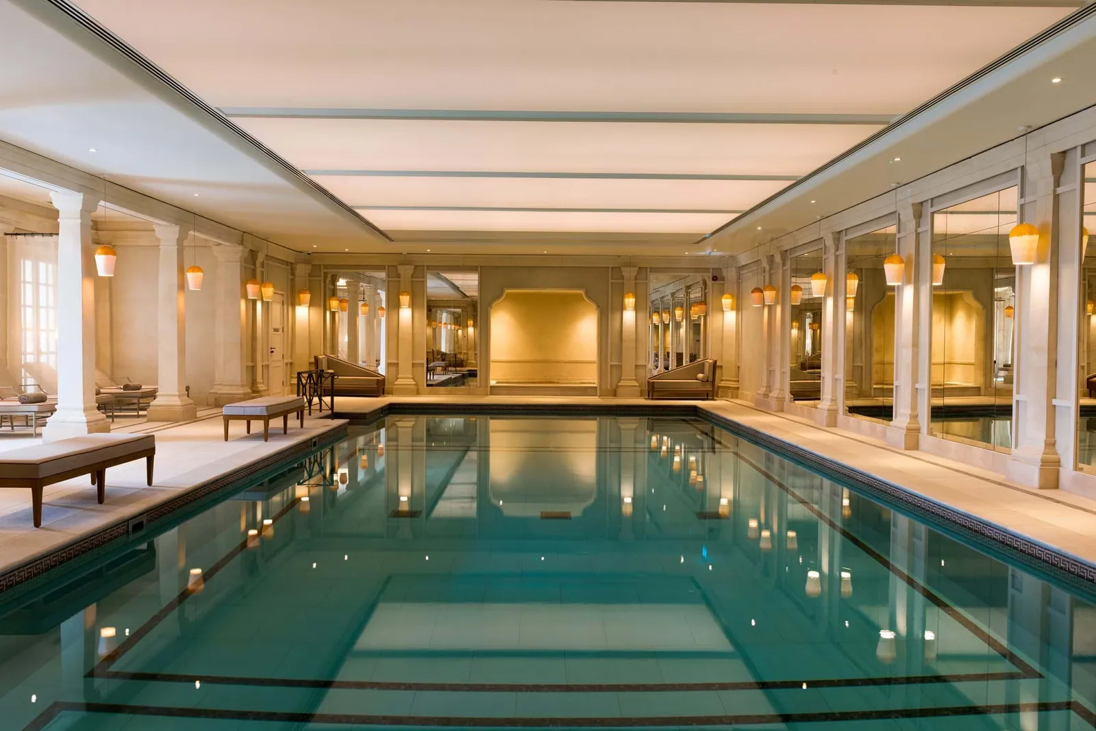 The spa’s indoor pool, with pale columns and loungers along the sides