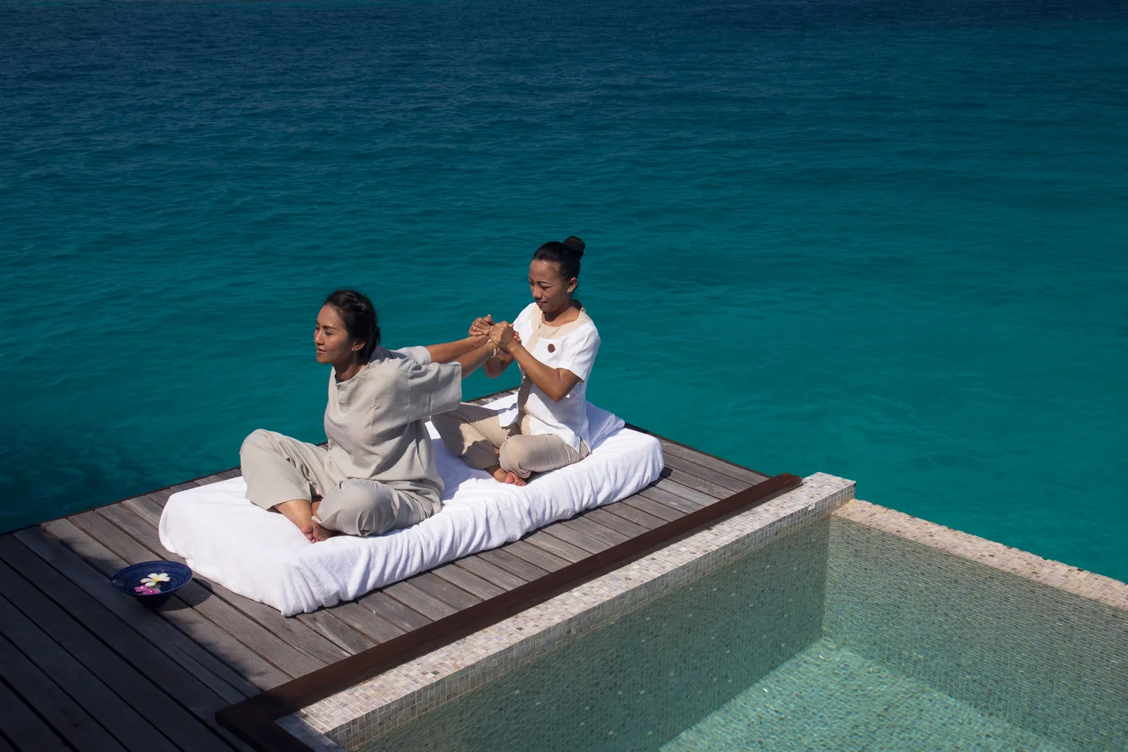 A Thai massage on one of the spa’s platforms over the lagoon, beside a plunge pool, sea all around.