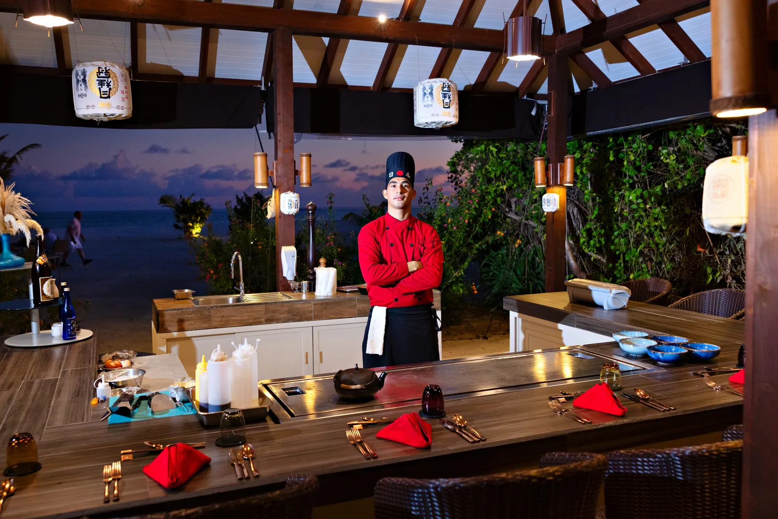The teppanyaki counter at the Japanese Garden, the chef in red and the lanterns