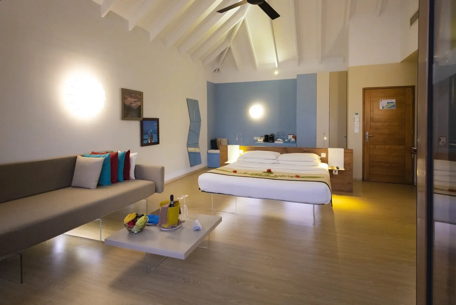 A Family Beach Villa bedroom, the bed and a long sofa
