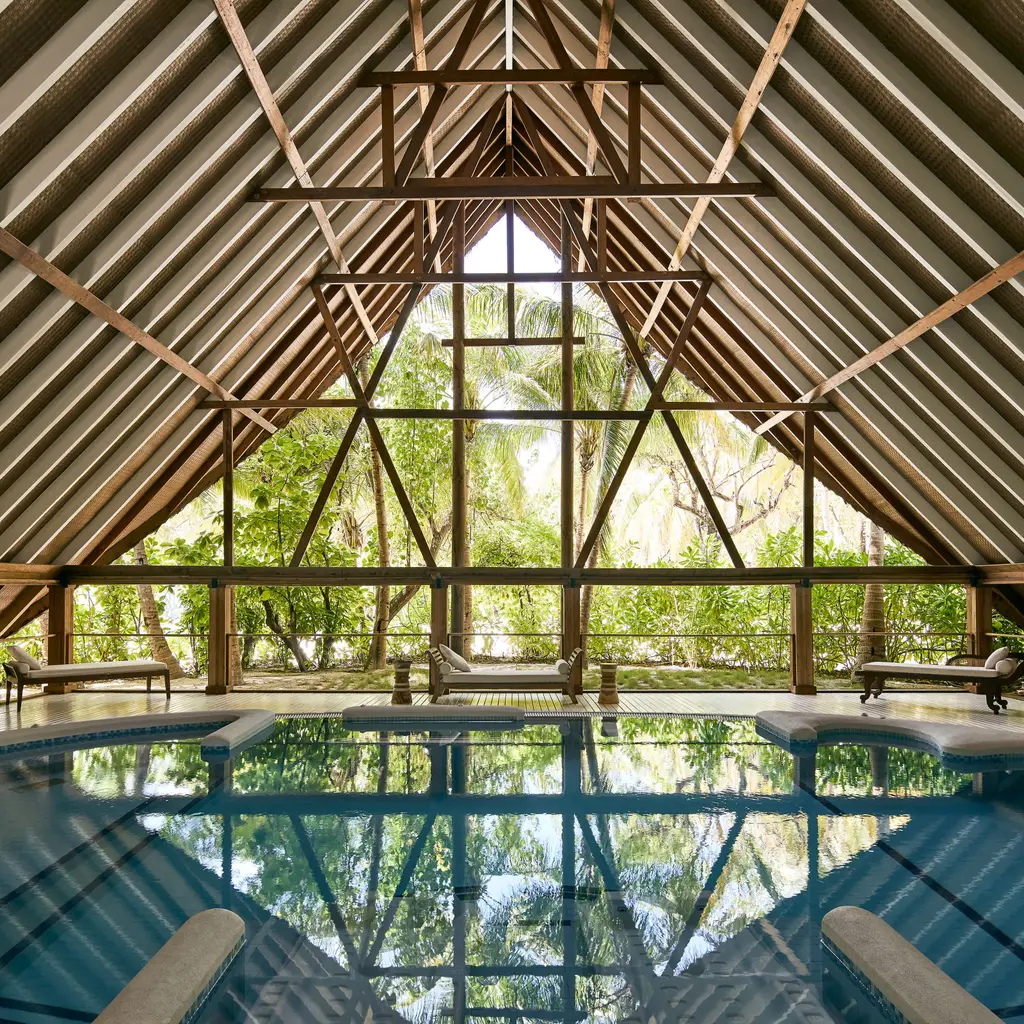 The COMO Shambhala hydrotherapy pool, under a timber roof open to the greenery