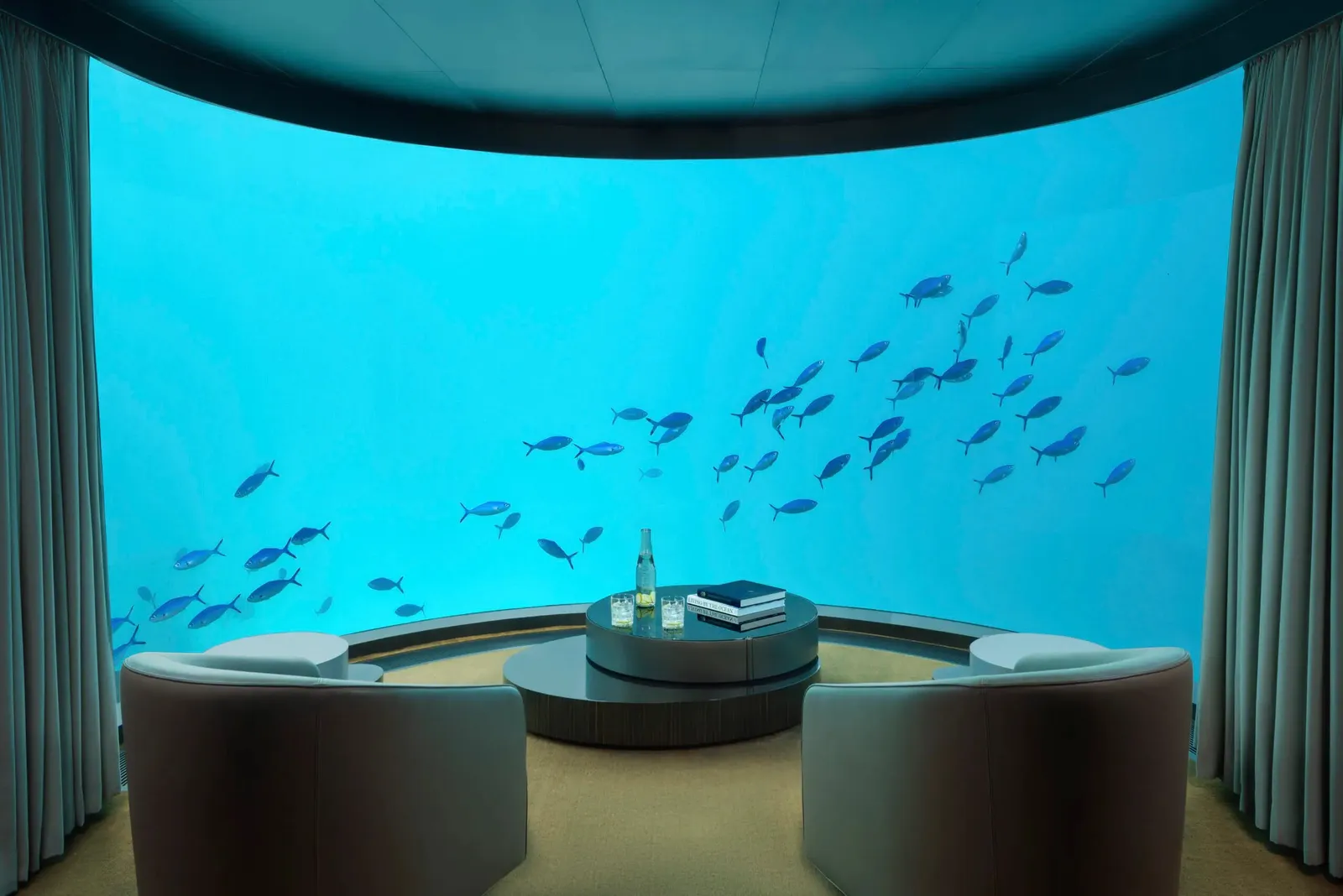The Muraka’s underwater lounge, its glass wall on the reef