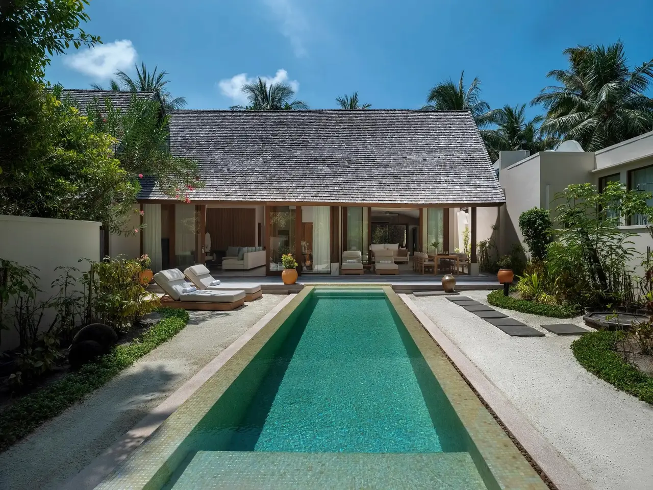 The 3 Bedroom Beach Suite’s long pool before the house