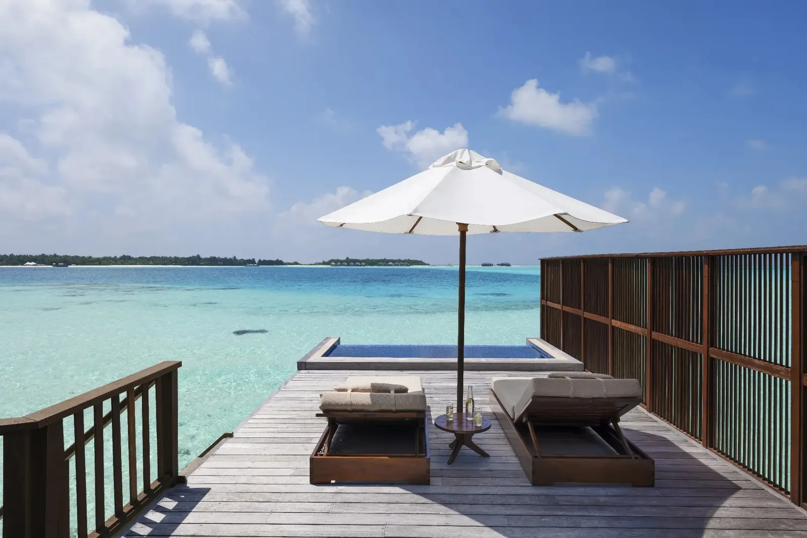 A Grand Water Villa with Pool’s deck, loungers over the sea
