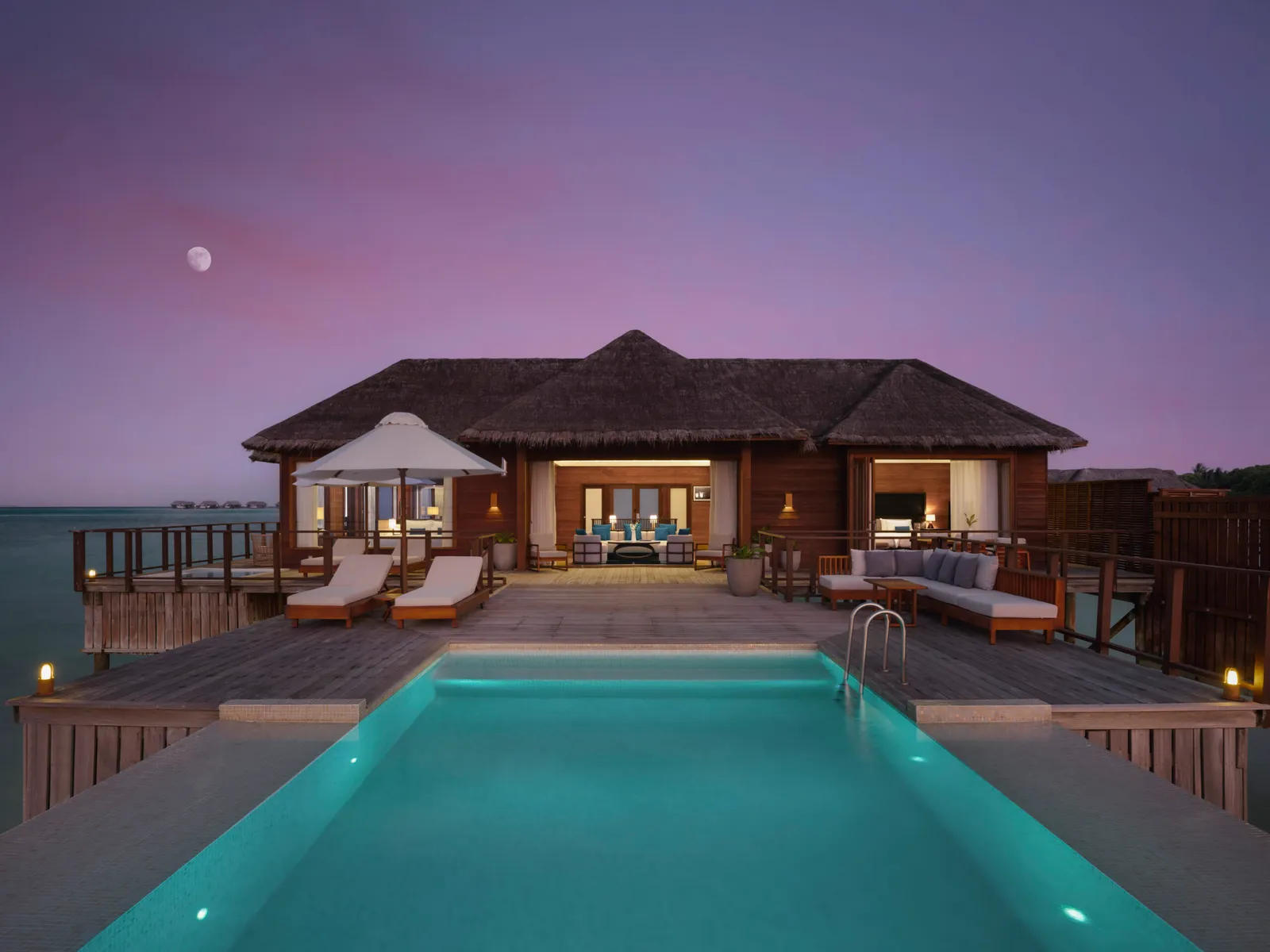 The 2 Bedroom Rangali Ocean Pavilion in the evening, its pool lit
