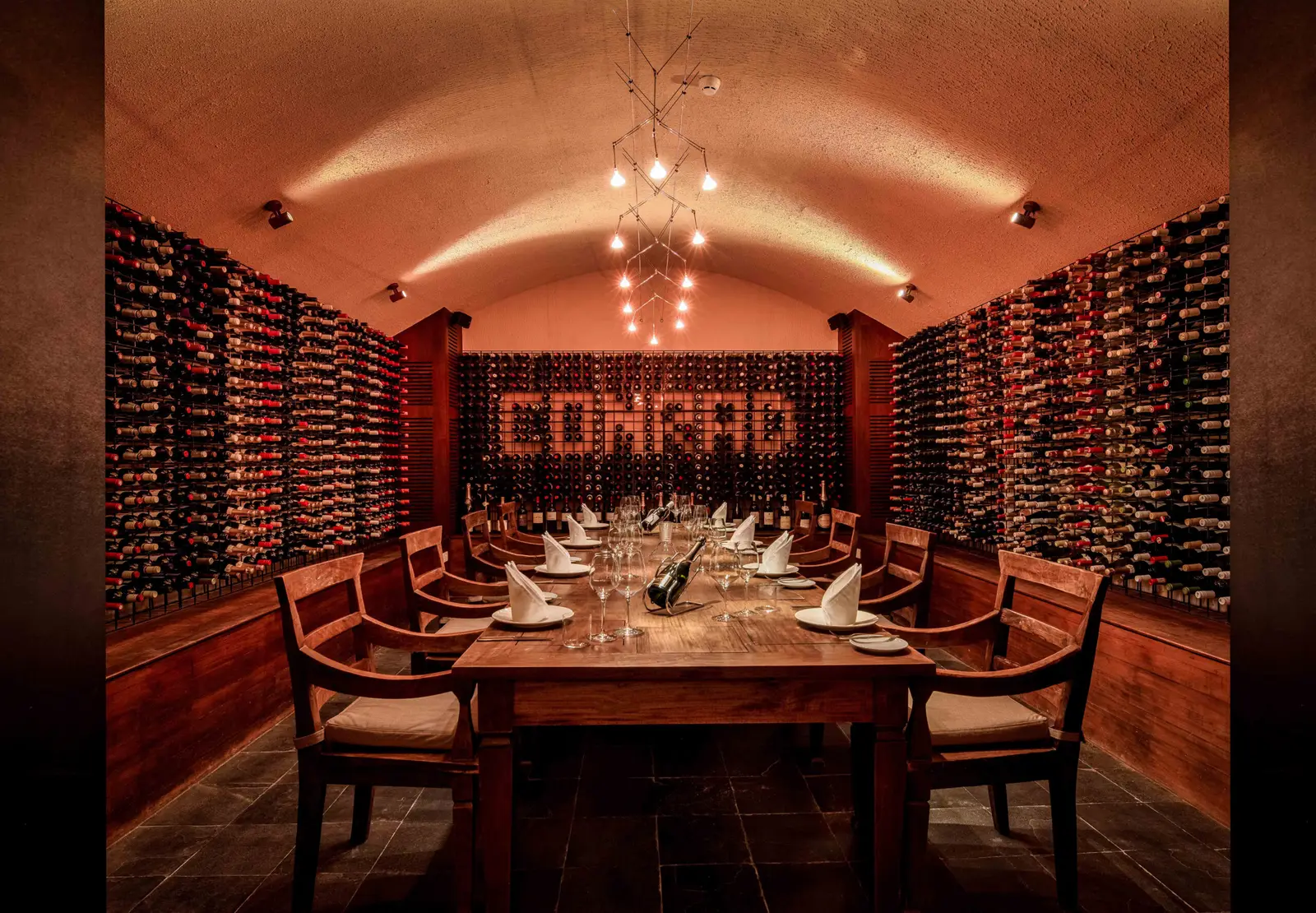 The underground cellar, a table laid among the bottles