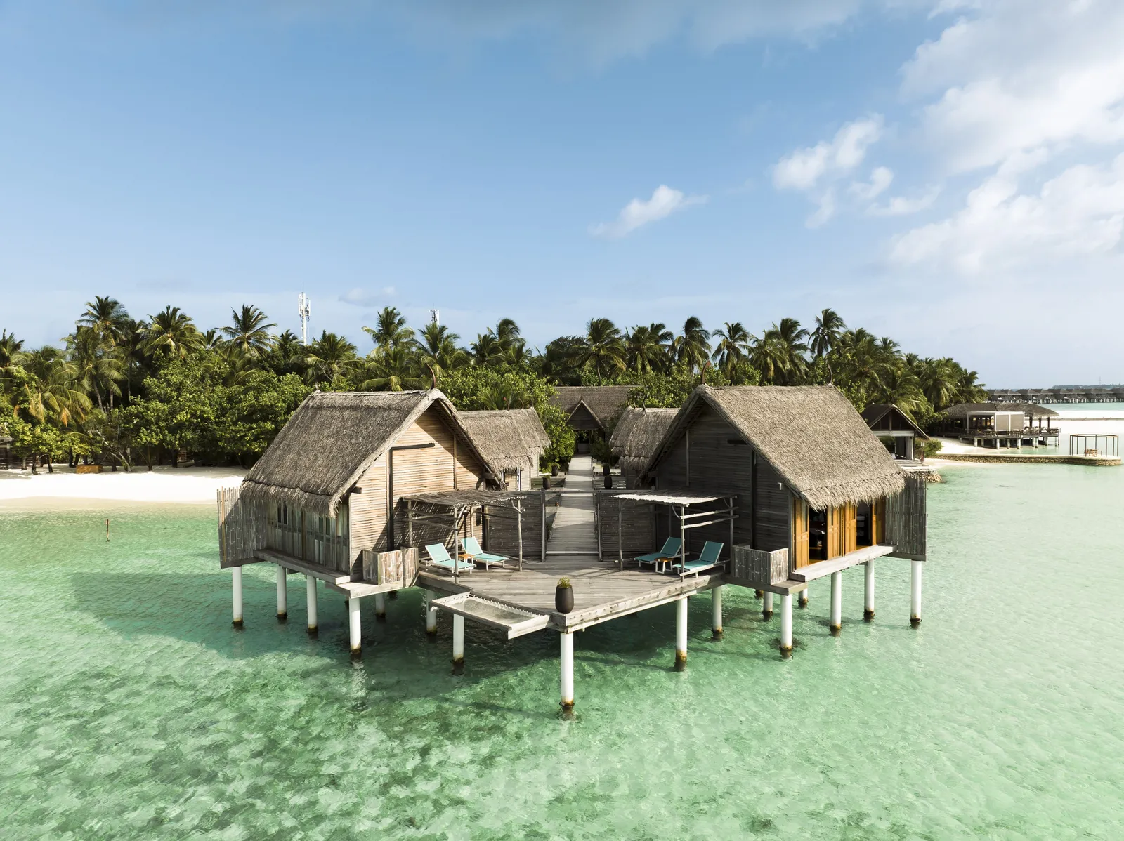 The spa’s thatched pavilions over the water, loungers on the deck