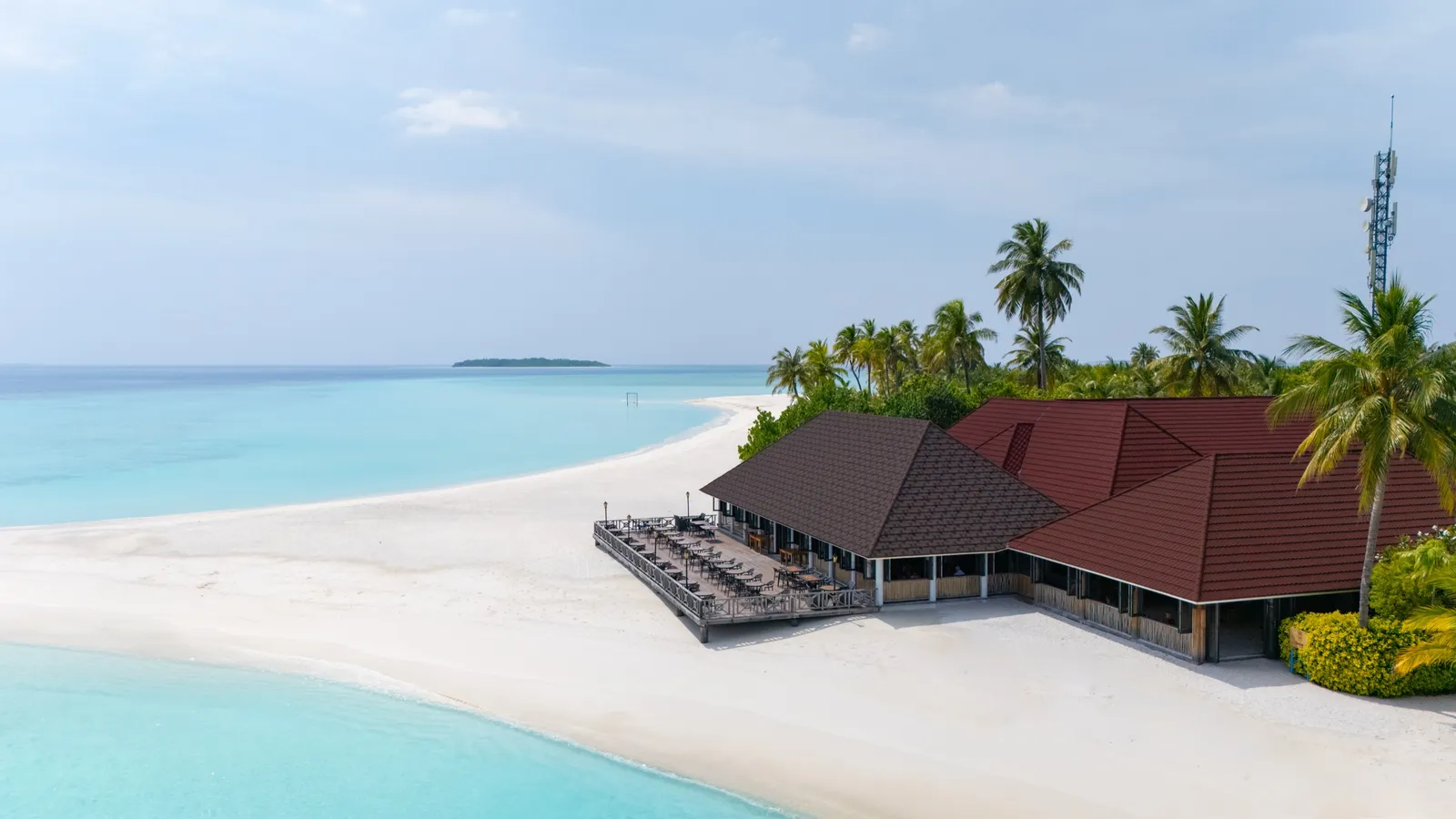 Dhandifulhu restaurant on the beach, its wooden deck facing the lagoon.