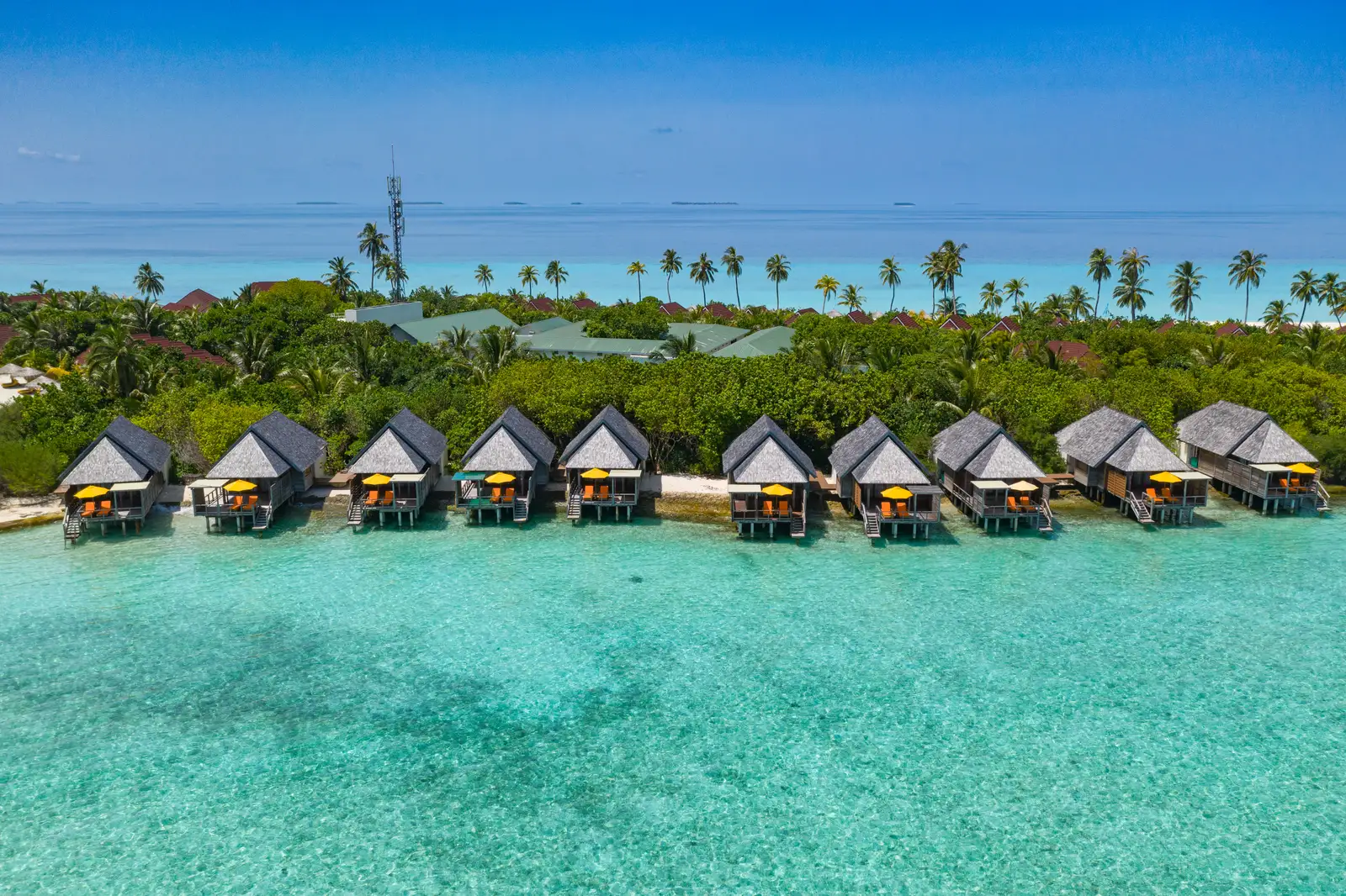 The Semi Water Villas at the lagoon’s edge, with the rest of the island behind them.