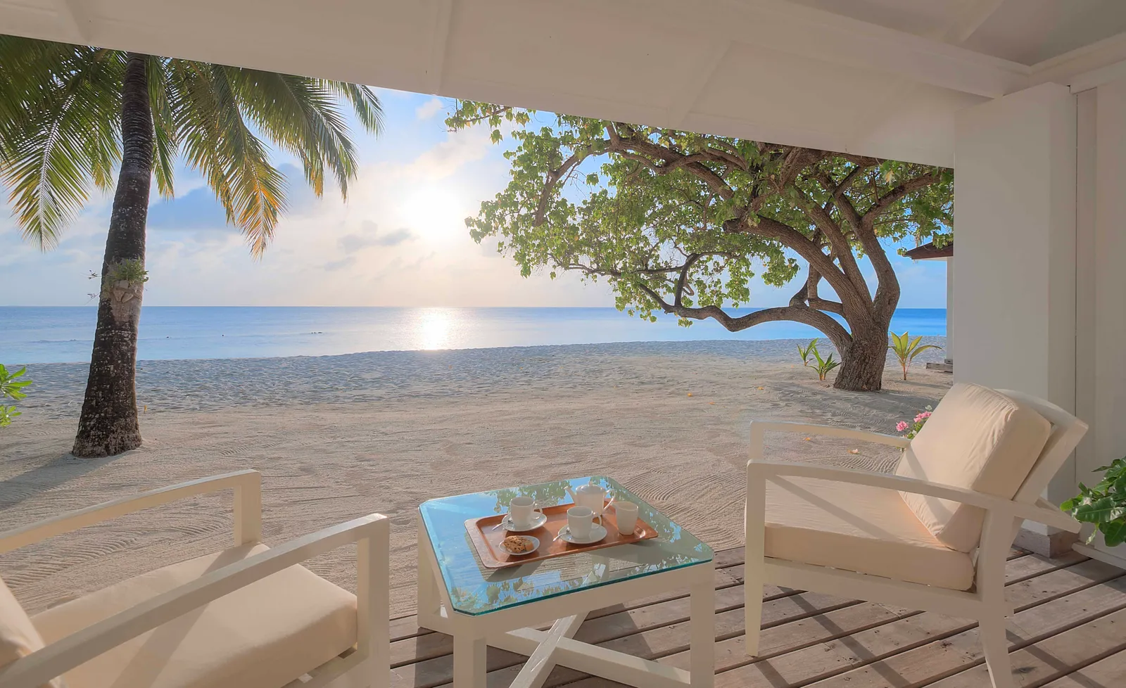 A Beach Front Villa’s veranda, its armchairs and table facing the beach and the sea.