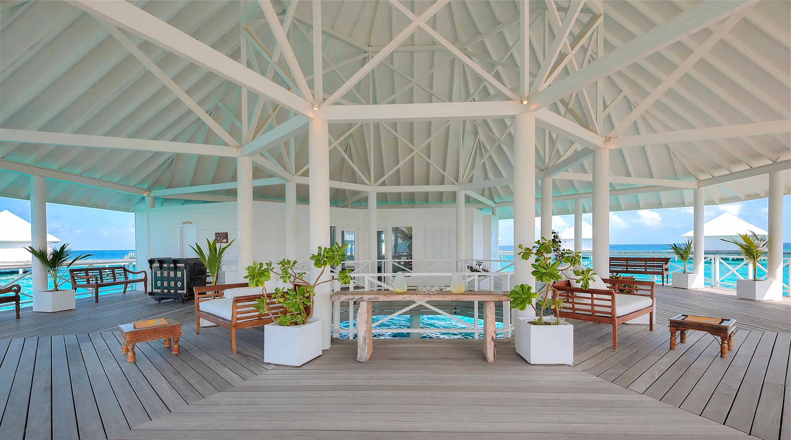 The Serena Spa’s open pavilion over the lagoon, with its white roof and plants.