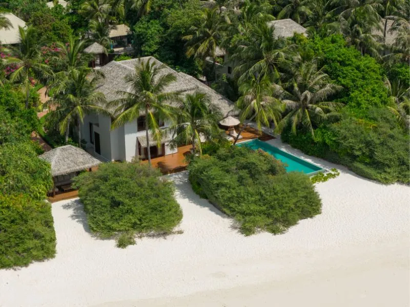 The Three Bedrooms Beach Pool Residence from above, among its gardens, with the pool and the beach close by.