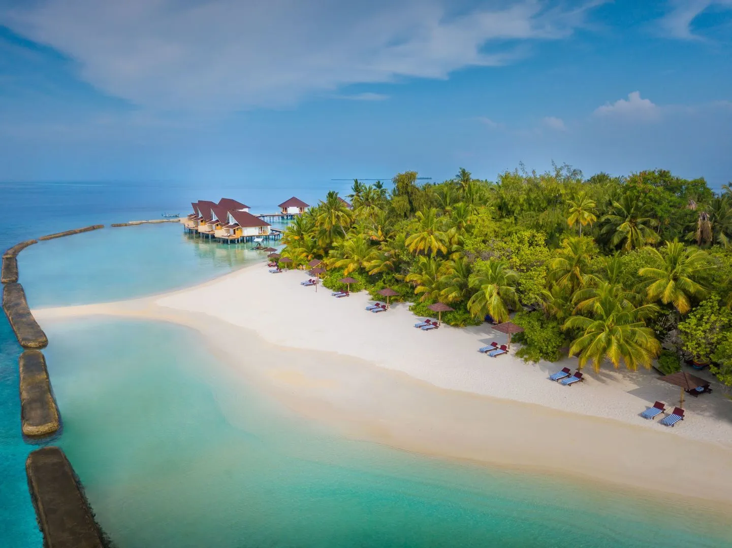 The white beach from the air, the pale lagoon and the palms