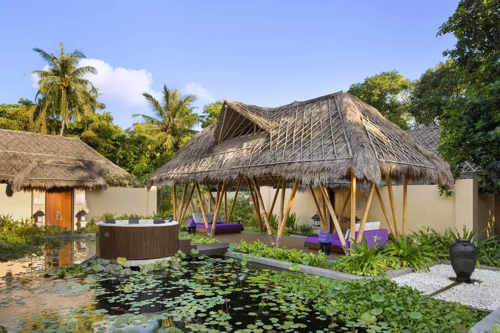 The Emerald Spa’s garden: the lily pond, the jacuzzi at its centre and the thatched pavilions with their daybeds.