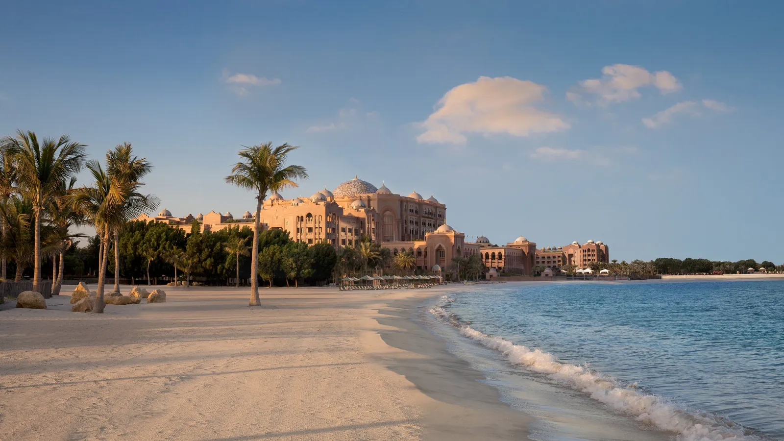 The private beach with the palace behind