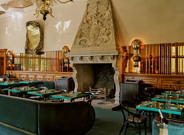 The Billiards Room: malachite-green velvet banquettes and a carved fireplace