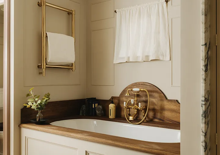 Hollyhock: the bathtub set in timber, with brass taps
