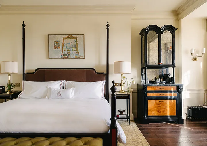 A Manor House Room: a four-poster and an inlaid armoire