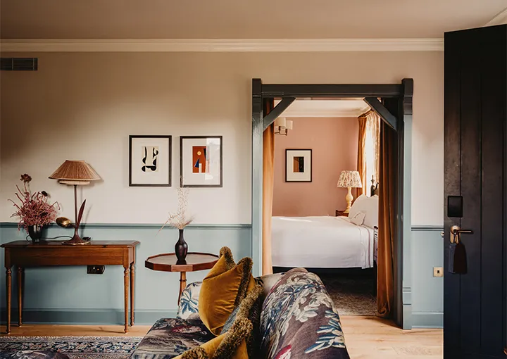 A Walled Garden Suite: the sitting room with the door open to the pink bedroom