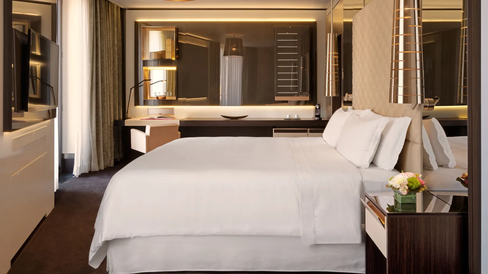 A Prestige room with a king bed, the desk and the television